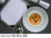 Beautiful and tasty gourmet food with menu . Стоковое фото, агентство Ingram Publishing / Фотобанк Лори