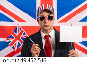 British male businessman with Brexit banner and UK flag. Стоковое фото, агентство Ingram Publishing / Фотобанк Лори