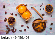 blue wooden background with cinnamon, anise, dog rose  and lemon. Стоковое фото, агентство Ingram Publishing / Фотобанк Лори