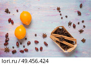 blue wooden background with cinnamon, anise, dog rose  and lemon. Стоковое фото, агентство Ingram Publishing / Фотобанк Лори