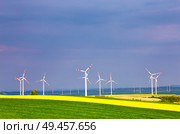 Spring yellow colza fields with wind power generators. Wind turbines park generating electricity. Green environment. Lower Austria near Poysdorf. Стоковое фото, агентство Ingram Publishing / Фотобанк Лори