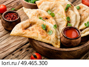 Cheburek, unleavened patty stuffed with minced meat.Cheburek, the national dish of the Crimean Tatars. Cheburek,dough pie with meat filling. Стоковое фото, агентство Ingram Publishing / Фотобанк Лори