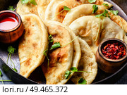Cheburek, unleavened patty stuffed with minced meat.Traditional Tatar pastry. Cheburek,dough pie with meat filling. Стоковое фото, агентство Ingram Publishing / Фотобанк Лори