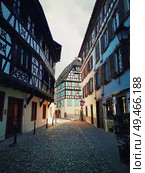 Strasbourg narrow streets of the old city with idyllic half timbered facades of medieval buildings. Beautiful architecture Petit France district, Alsace. Стоковое фото, агентство Ingram Publishing / Фотобанк Лори