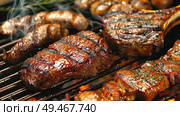 Steaks and vegetables sizzling and cooking on a hot grill with flames licking the food. Стоковое AI-изображение, AI-художник Данила Большаков / Фотобанк Лори