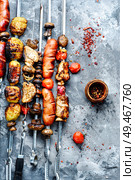 Shish kebabs - grilled meat and sausages.Bbq.Traditional oriental kebap and shashlik skewer. Grilled meat dishes. Стоковое фото, агентство Ingram Publishing / Фотобанк Лори