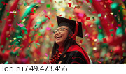 A woman stands proudly in her graduation cap and gown, celebrating her academic achievement. Стоковое AI-изображение, AI-художник Данила Большаков / Фотобанк Лори