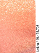 Christmas holiday living glittering defocused coral pink background with bokeh lights. Christmas glittering background. Стоковое фото, агентство Ingram Publishing / Фотобанк Лори