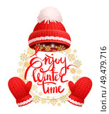 Enjoy winter time greeting card with warm red hat, white pom-pom, knitted gloves. Woolen mittens and headwear, realistic outfit gauntlet, personal accessories. Enjoy Wintertime Greeting Card Warm Red Hat, Glove. Стоковая иллюстрация, агентство Ingram Publishing / Фотобанк Лори