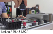 Repair of an appliance with a motherboard in an electronics repair laboratory using troubleshooting and maintenance tools and components. Стоковое видео, видеограф Darya Komarova / Фотобанк Лори