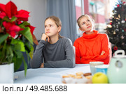 Schoolgirl sitting at the table after quarrel with mother. Стоковое фото, фотограф Яков Филимонов / Фотобанк Лори