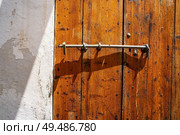 Ibiza Eivissa downtown Dalt Vila wooden door in Balearic Islands. Стоковое фото, агентство Ingram Publishing / Фотобанк Лори