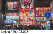Osaka, Japan - Sep 22 2024, 4k, Panoramic view of Dotonbori street with various cafes, restaurants, bright signs and advertisements, illumination, a lot of people walking, at night, Osaka, Japan. Редакционное видео, видеограф Сергей Богомяко / Фотобанк Лори