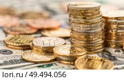 A stack of gold coins placed on a mound of paper money, representing wealth and financial prosperity. Стоковое AI-изображение, AI-художник Данила Большаков / Фотобанк Лори