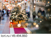 Beautiful Christmas background 2026.Abstract blurred Christmas background with Christmas tree garlands in warm shades. Стоковое фото, фотограф Photojuli / Фотобанк Лори