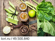 Rhubarb jam and raw cut rhubarb.Ingredients of making jam. Homemade rhubarb jam. Стоковое фото, агентство Ingram Publishing / Фотобанк Лори