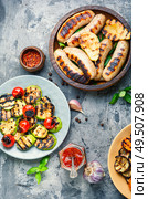 Grilled sausages fried with pear and vegetables. Autumn food.. Grilled sausages with vegetables. Стоковое фото, агентство Ingram Publishing / Фотобанк Лори