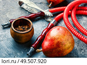 Smoking hookah.Details of Turkish hooka.Shisha with a fruity aroma of tobacco.. Oriental smoking hookah. Стоковое фото, агентство Ingram Publishing / Фотобанк Лори