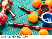 Smoking hookah.Details of Turkish hooka.Shisha with a fruity aroma of tobacco.. Oriental smoking hookah. Стоковое фото, агентство Ingram Publishing / Фотобанк Лори