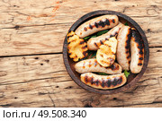 Grilled sausages fried with pear and.Grill menu.Bbq food. Grilled sausages with pear. Стоковое фото, агентство Ingram Publishing / Фотобанк Лори