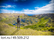 a man stands near an Rano Kau volcano, Easter island (Chile) Стоковое фото, агентство Ingram Publishing / Фотобанк Лори