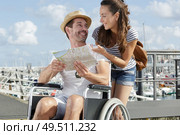 disability man talking to wife about where to go. Стоковое фото, агентство Ingram Publishing / Фотобанк Лори