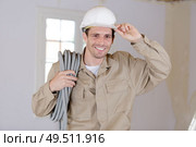 electrician with helmet and cable. Стоковое фото, агентство Ingram Publishing / Фотобанк Лори