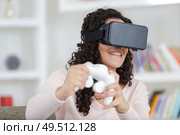 woman using the virtual reality headset. Стоковое фото, агентство Ingram Publishing / Фотобанк Лори