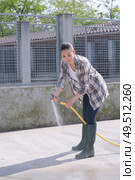 cleaning time for kennel assistant. Стоковое фото, агентство Ingram Publishing / Фотобанк Лори