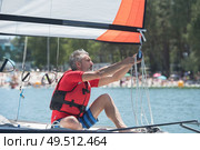 professional waterman training on lake with catamaran. Стоковое фото, агентство Ingram Publishing / Фотобанк Лори