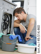 a worried with leakage water issue. Стоковое фото, агентство Ingram Publishing / Фотобанк Лори