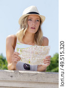 tourist planning vacation using world map. Стоковое фото, агентство Ingram Publishing / Фотобанк Лори