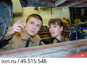 worker looking at a broken vehicle. Стоковое фото, агентство Ingram Publishing / Фотобанк Лори