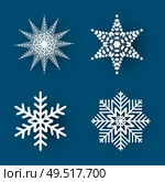 Christmas paper cut, four different white snowflakes on blue background. Decoration for winter holiday. Handmade small postcard vector illustration. Christmas Paper Cut Four White Snowflakes Vector. Стоковая иллюстрация, агентство Ingram Publishing / Фотобанк Лори