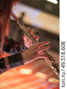 woman playing flute at a concert. Стоковое фото, агентство Ingram Publishing / Фотобанк Лори