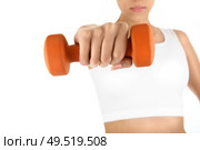 The woman trains muscles of the hands, isolated. Стоковое фото, агентство Ingram Publishing / Фотобанк Лори
