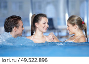 The three friends who are in pool, communicate. Стоковое фото, агентство Ingram Publishing / Фотобанк Лори