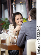 Two happy enamoured sit at restaurant. Стоковое фото, агентство Ingram Publishing / Фотобанк Лори
