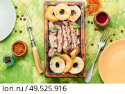 Grilled duck breast on cutting board.Duck breast with ananas sauce on green background. Roasted duck with pineapple. Стоковое фото, агентство Ingram Publishing / Фотобанк Лори