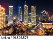 night view of illuminated Lujiazui skyline and Ring Road Circular Footbridge, Shanghai, China. illuminated Lujiazui skyline and Ring road circular footbridge, Shanghai, China. Стоковое фото, агентство Ingram Publishing / Фотобанк Лори