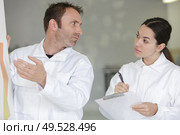 the decorators are talking about results. Стоковое фото, агентство Ingram Publishing / Фотобанк Лори