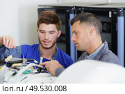 portrait of men deactivating the bomb. Стоковое фото, агентство Ingram Publishing / Фотобанк Лори