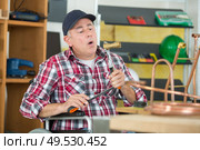 craftsman soldering a copper pipe. Стоковое фото, агентство Ingram Publishing / Фотобанк Лори