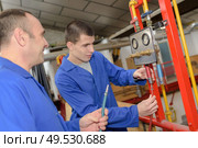portrait of men in the factory. Стоковое фото, агентство Ingram Publishing / Фотобанк Лори
