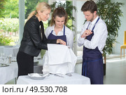 Waiter and waitress in training. Стоковое фото, агентство Ingram Publishing / Фотобанк Лори