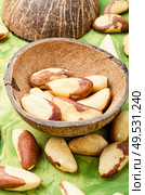 Bertholletia.Peeled brazil nut in wooden mortar.Healthy food. Brazil nut or bertholletia. Стоковое фото, агентство Ingram Publishing / Фотобанк Лори