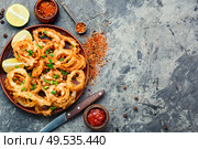 Fried squid or calamari rings with sauce. Crispy fried squid rings. Стоковое фото, агентство Ingram Publishing / Фотобанк Лори