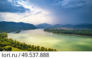 Aerial view of Danube river near Visegrad in Hungary. Summer rain and stormy weather. Danube river valley panorama. . Стоковое фото, агентство Ingram Publishing / Фотобанк Лори