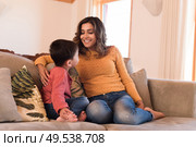 Mother and son relaxing together in the living room. Стоковое фото, агентство Ingram Publishing / Фотобанк Лори