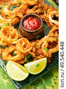 Crunchy deep fried squid rings in batter.Fried squid rings breaded with lime. Fried squid rings breaded. Стоковое фото, агентство Ingram Publishing / Фотобанк Лори